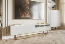 Veldio TV cabinet with a milled front and a 175 cm recess. White with gold legs.