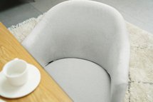 Optival upholstered chair with gray and blue armrests