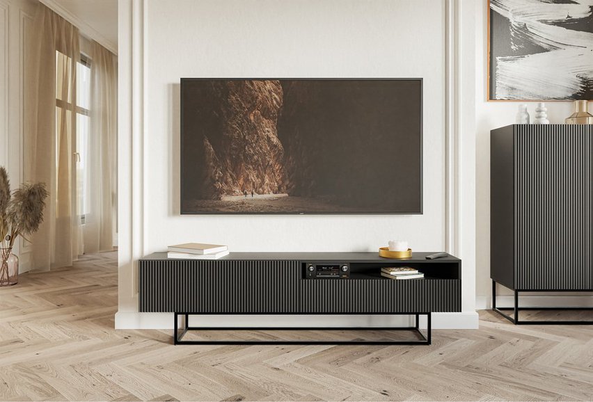 Veldio TV cabinet with a milled front and a 175 cm recess. Black with black legs.