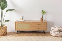 Crattale TV cabinet 140 cm with a natural rattan front