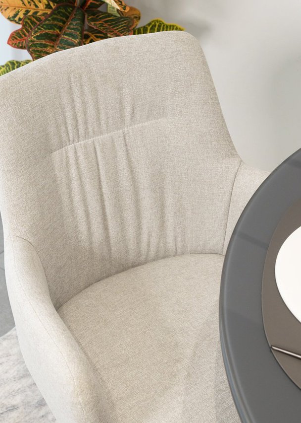 Rehoolt upholstered swivel chair with beige armrests