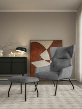 Suppet lounge chair with footstool in warm gray boucle fabric